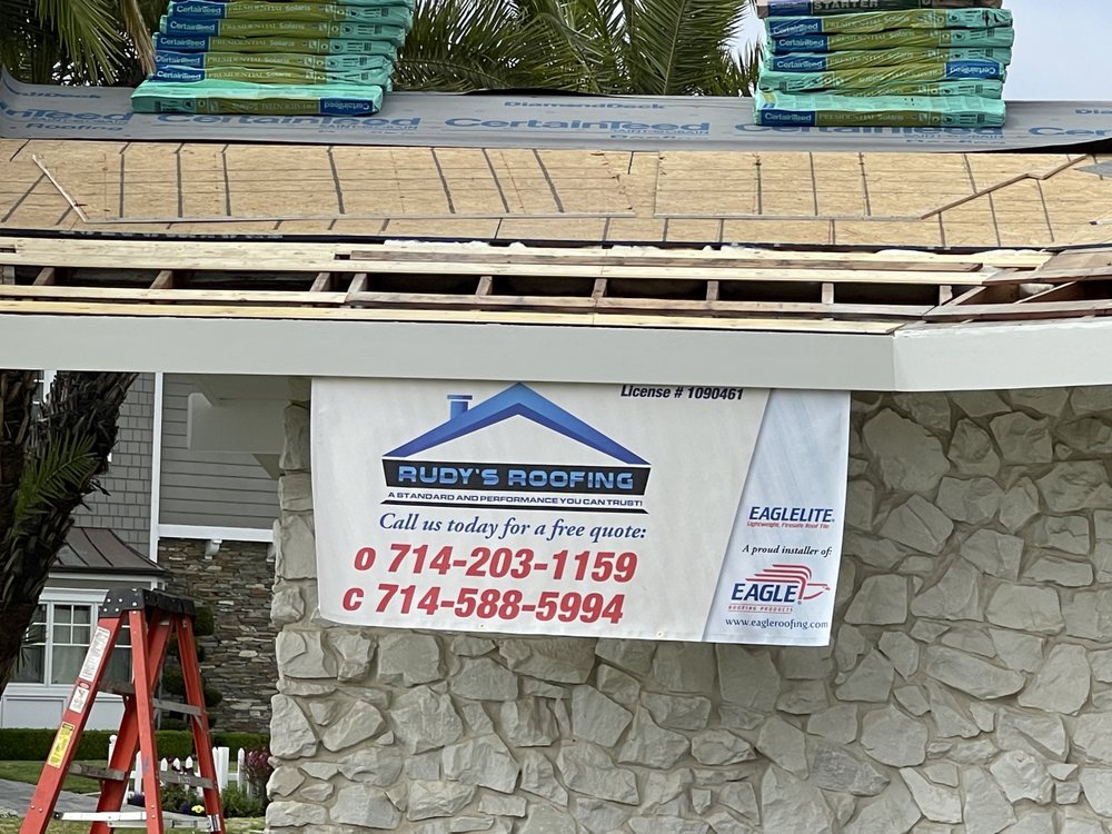 Slide of Rudy’s roofing