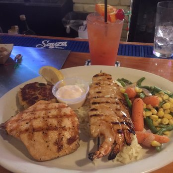 Shells Seafood - Brandon - The Grilled Seafood Combo Platter. Salmon, Shrimp and crab cake, rice and mixed veggies. Delish!!! - Seafood Near Me - Brandon, Florida Shells Seafood - Brandon - The Grilled Seafood Combo Platter. Salmon, Shrimp and crab cake, rice and mixed veggies. Delish!!! - Seafood Near Me - Brandon, Florida