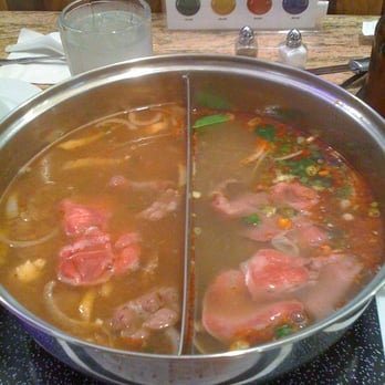 Hot Pot Heaven - In the red corner (right), Thai broth and in the blue corner, Kimchee broth. - Vietnamese Near Me - Honolulu, Hawaii Hot Pot Heaven - In the red corner (right), Thai broth and in the blue corner, Kimchee broth. - Vietnamese Near Me - Honolulu, Hawaii