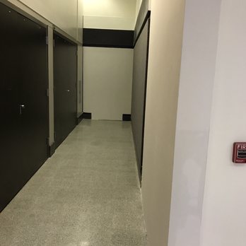American Express Centurion Lounge - The sign points here and says there is an elevator behind the duty free shop. Not the case - Airport Lounges Near Me - Houston, Texas American Express Centurion Lounge - The sign points here and says there is an elevator behind the duty free shop. Not the case - Airport Lounges Near Me - Houston, Texas