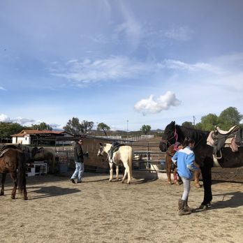 Susie Q Ranch - Staff working to get the horses ready and organized. Susie has the list of people riding before we arrived. - Horseback Riding Near Me - Murrieta, California Susie Q Ranch - Staff working to get the horses ready and organized. Susie has the list of people riding before we arrived. - Horseback Riding Near Me - Murrieta, California