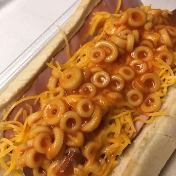 Atomic Dogs - a hot dog covered in macaroni and cheese - Street Vendors Near Me