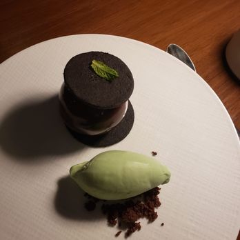 Glass Light - Natural mint ice cream over chocolate cookie crumbles, served with a sphere of chocolatey goodness - New American Near Me - Norfolk, Virginia