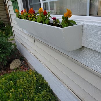 Sneed Structures - a window box with flowers in it - General Contractors Near Me Sneed Structures - a window box with flowers in it - General Contractors Near Me