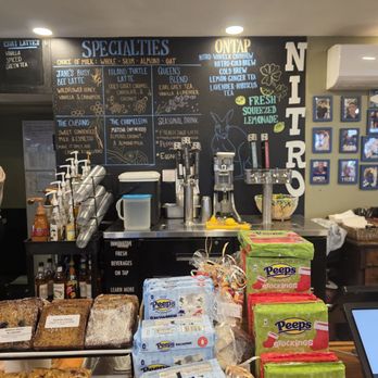 Blue Kangaroo Cafe - Some of the jam packed selection at the counter and behind, the menu for drinks (coffee/tea) - Cafes Near Me - Barrington, Rhode Island Blue Kangaroo Cafe - Some of the jam packed selection at the counter and behind, the menu for drinks (coffee/tea) - Cafes Near Me - Barrington, Rhode Island