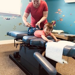Flack Family Chiropractic - Dr. Beth adjusting a baby