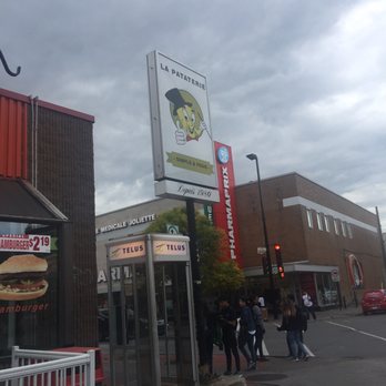 La Pataterie - a group of people walking down the street - Burgers Near Me - Montreal, Quebec La Pataterie - a group of people walking down the street - Burgers Near Me - Montreal, Quebec