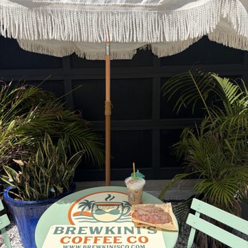 BrewKini’s Coffee - Table and umbrella sitting area - Coffee & Tea Near Me - Tampa Bay, Florida BrewKini’s Coffee - Table and umbrella sitting area - Coffee & Tea Near Me - Tampa Bay, Florida