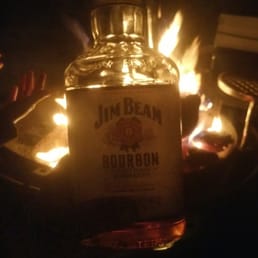 a bottle of jim beam bourbon sitting on a table
