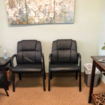 Audio Center of Babylon - to the left upon entering office - chairs and flower picture - Hearing Aid Providers Near Me - Babylon, New York Audio Center of Babylon - to the left upon entering office - chairs and flower picture - Hearing Aid Providers Near Me - Babylon, New York