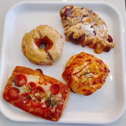 Paris Baguette - Clockwise from the bottom: pepperoni pizza, cronut, raspberry almond croissant, hash brown bread