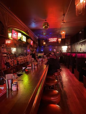 Photo of Dino's Tomato Pie - Seattle, WA, US. Awesome long bar and "old fashioned" interior