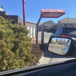 the reflection of a car in a rear view mirror