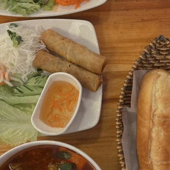 Mama Pho - Spicy beef pho with a side of French bread. #4 lunch special with lemon grass chicken, chicken flavored rice and spring rolls. - Vietnamese Near Me - Honolulu, Hawaii Mama Pho - Spicy beef pho with a side of French bread. #4 lunch special with lemon grass chicken, chicken flavored rice and spring rolls. - Vietnamese Near Me - Honolulu, Hawaii