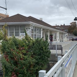 LIRR Broadway Station - Indoor waiting area and ticket machine.