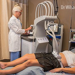 Dr. Wilson performing SculpSure treatment, an amazing fat elimination technique that takes only 25 minutes.
