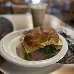 Capriccio Cafe - Croissant sandwich fully loaded and a vanilla iced coffee