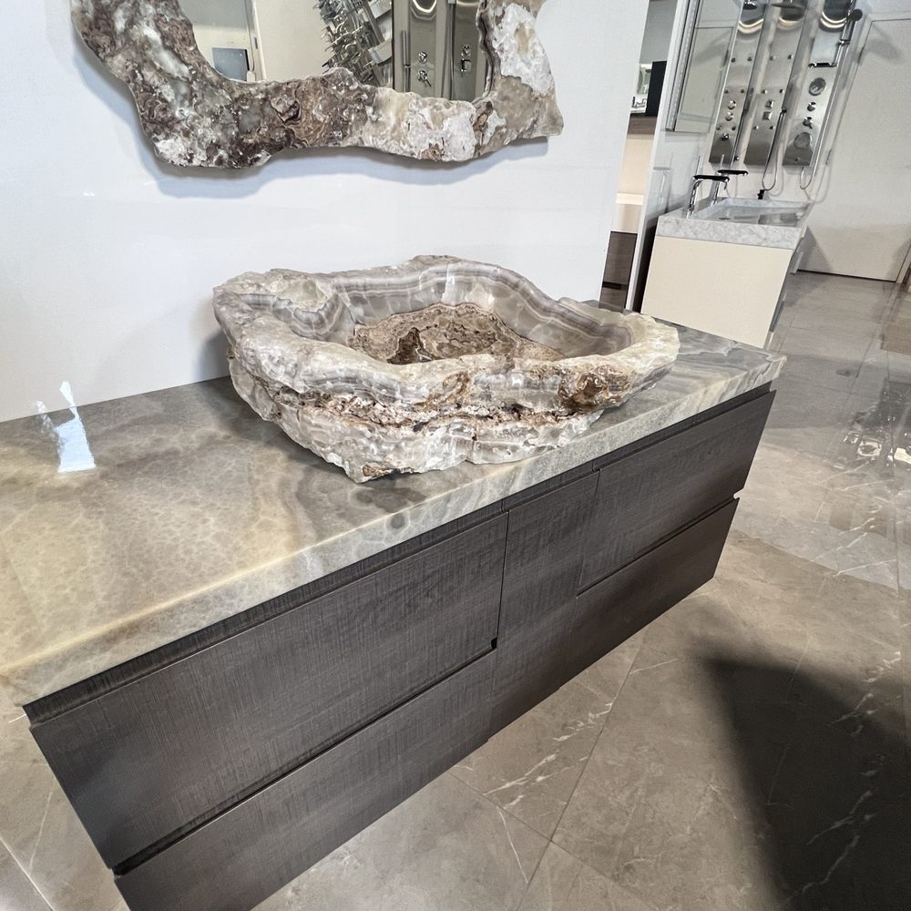 Klass Bathroom and Kitchen - Beautiful, unique quartz?? sink and mirror. Cleaning will likely be a mission to keep clean with all the divots and it's $15k - Kitchen & Bath Near Me - Hialeah, Florida