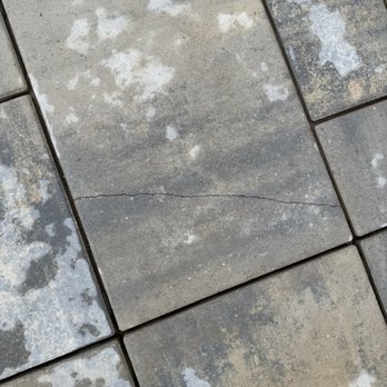Stout Creek Landscapes - One of many cracked pavers on the day they put them in and texted me to go out and see how good everything looked. - Landscaping Near Me - Belmont, Michigan