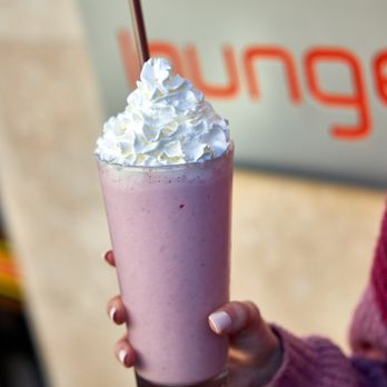 Burger Lounge - a woman holding a pink drink - Burgers Near Me - Campbell, California Burger Lounge - a woman holding a pink drink - Burgers Near Me - Campbell, California