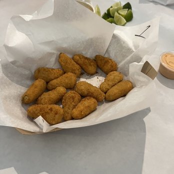 Crab Pub - The crab poppers. Comes with the sauce which is like spicy Mayo I think. - Seafood Near Me - Oceanside, California Crab Pub - The crab poppers. Comes with the sauce which is like spicy Mayo I think. - Seafood Near Me - Oceanside, California