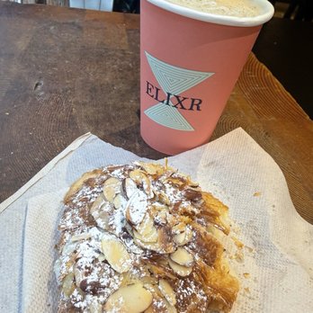 Elixr Coffee Roasters - Caramel black salt latte and almond croissant. - Coffee Roasteries Near Me - Philadelphia, Pennsylvania