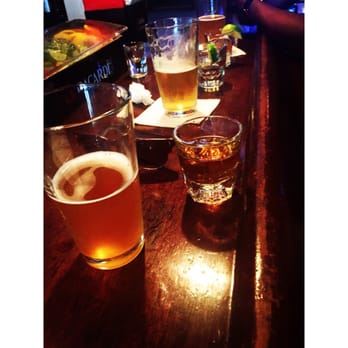Westside Tavern - a row of beer glasses on a bar - Bars Near Me - New York, New York Westside Tavern - a row of beer glasses on a bar - Bars Near Me - New York, New York