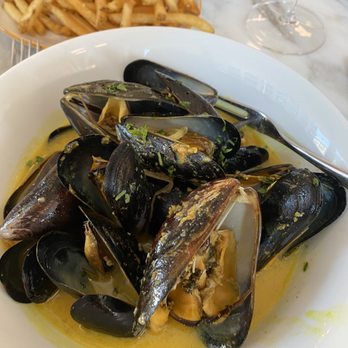 Chez Maggy - Mussels with amazing curry sauce and frites to die for - French Near Me - Denver, Colorado Chez Maggy - Mussels with amazing curry sauce and frites to die for - French Near Me - Denver, Colorado