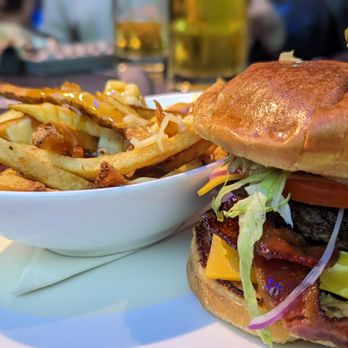 Real Sports - a hamburger and fries on a plate - Sports Bars Near Me - Toronto, Ontario Real Sports - a hamburger and fries on a plate - Sports Bars Near Me - Toronto, Ontario