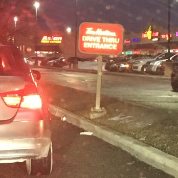 Tim Hortons - a car parked in a parking lot at night - Coffee & Tea Near Me - Brampton, Ontario
