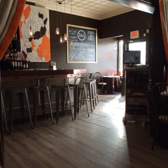 CRāVing Restaurant - Adorable view of the bar from the separate dining room - New American Near Me - Buffalo, New York