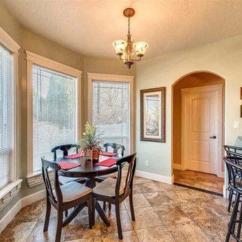 JRD Construction - a dinning room with a table and chairs - General Contractors Near Me