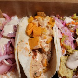 Mucho Burrito Fresh Mexican Grill - Mucho ONIONS should be the name of this place. All the pink is the pickled onions and there are more hidden under the sauce.