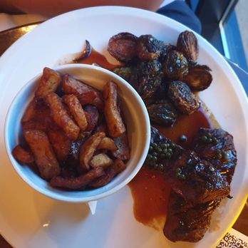 Pub Burgundy Lion - Steak with a great sauce, brussel sprouts and fries - British Near Me - Montreal, Quebec