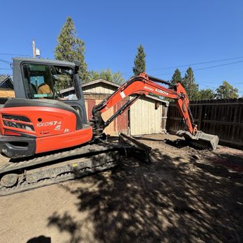 C3 Enterprise - Excavator digging drainage hole for rain water in backyard. - Excavation Services Near Me - Phoenix, Oregon C3 Enterprise - Excavator digging drainage hole for rain water in backyard. - Excavation Services Near Me - Phoenix, Oregon
