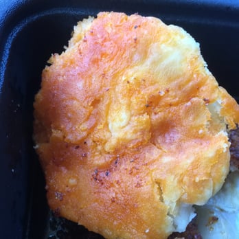 KFC - The biscuit quickly soaks up the oil from the paste on the chicken, - Fast Food Near Me - Greensboro, North Carolina