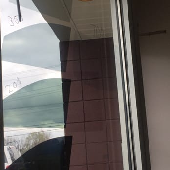 JM Tint - Different tints on the wall for examples - Auto Glass Services Near Me - Columbus, Ohio