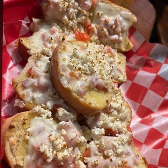 Turoni's Pizzery & Brewery - More of a garlic bread with tomatoes & different cheeses on top. - Pizza Near Me - Evansville, Indiana Turoni's Pizzery & Brewery - More of a garlic bread with tomatoes & different cheeses on top. - Pizza Near Me - Evansville, Indiana