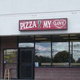the front of a pizza shop the front of a pizza shop