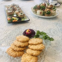 Cheese crackers, mushroom tarts and finger sandwiches