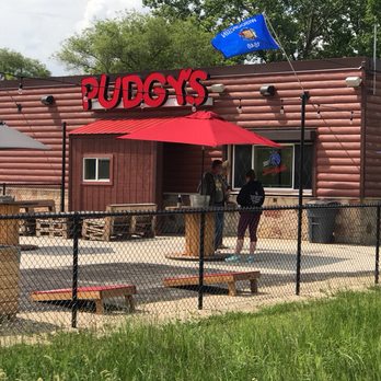 Pudgy's Pub - a man standing outside of a restaurant - Pubs Near Me - Racine, Wisconsin Pudgy's Pub - a man standing outside of a restaurant - Pubs Near Me - Racine, Wisconsin