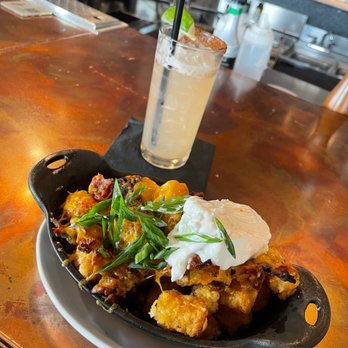 The General Public - A signature margarita with loaded tots. - New American Near Me - San Antonio, Texas The General Public - A signature margarita with loaded tots. - New American Near Me - San Antonio, Texas
