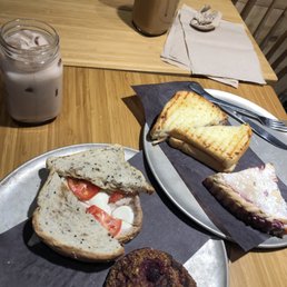 Turkey sandwich (a la dinde),  ham and cheese sandwich,  iced chai latte, hot coffee,  strawberry pie, boule framboises -choco