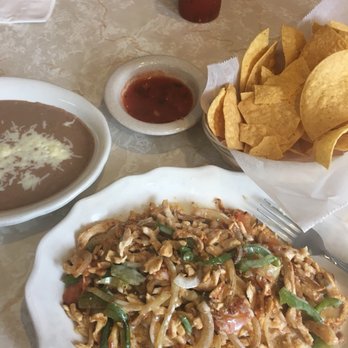 El Nopal Mexicana Restaurant - Chicken & rice with side of retried beans. - Mexican Near Me - Trenton, Missouri El Nopal Mexicana Restaurant - Chicken & rice with side of retried beans. - Mexican Near Me - Trenton, Missouri