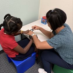 South Coast Pediatric Physical Therapy - Practicing tying shoes