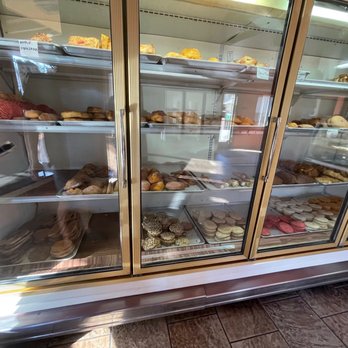 Panaderia Y Pizzeria Primos Bakery - a display case full of donuts - Bakeries Near Me - Thornton, California Panaderia Y Pizzeria Primos Bakery - a display case full of donuts - Bakeries Near Me - Thornton, California