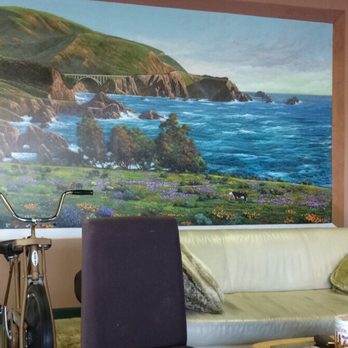 Contours Beauty Salon - Waiting area featuring mural by Sun Kim. There is a sofa, table full of magazines, and even an exercise bike! - Hair Salons Near Me - Marina, California Contours Beauty Salon - Waiting area featuring mural by Sun Kim. There is a sofa, table full of magazines, and even an exercise bike! - Hair Salons Near Me - Marina, California