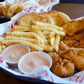 Raising Cane's Chicken Fingers - a basket of fried chicken and french fries - Fast Food Near Me - Flower Mound, Texas Raising Cane's Chicken Fingers - a basket of fried chicken and french fries - Fast Food Near Me - Flower Mound, Texas