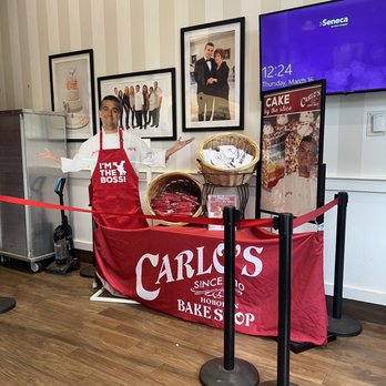 Carlo's Bakery - a man standing in front of a display of baked goods - Bakeries Near Me - San Antonio, Texas