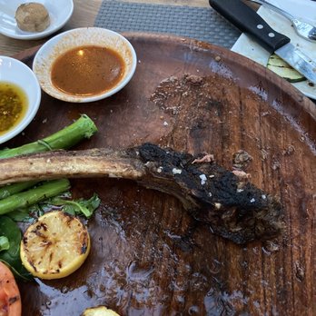 Onlywood Grill - Remains of the 34 oz Bone in Tomahawk Ribeye - Italian Near Me - Key West, Florida Onlywood Grill - Remains of the 34 oz Bone in Tomahawk Ribeye - Italian Near Me - Key West, Florida